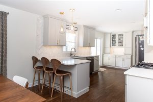 View of a modern kitchen with white cabinets and countertops