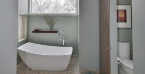 Modern minimalist bathroom with sleek white tub